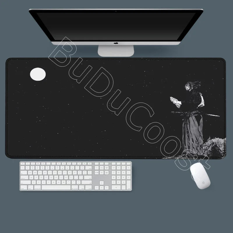 A black gaming mousepad with a silhouette of a figure and a white keyboard and mouse placed on it.
