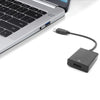 A silver laptop with a USB port and an adapter cable connected to a small black dongle.